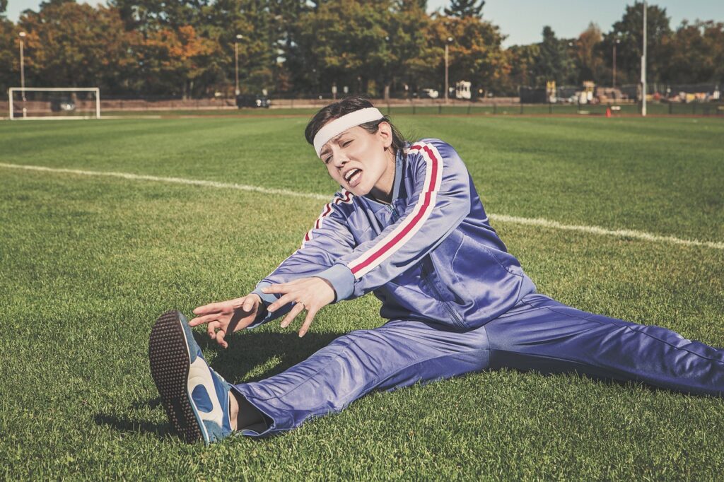stretching, sports, woman, athlete, fitness, sport, healthy, exercise, workout, young, female, body, lifestyle, training, fit, health, stretch, people, active, girl, adult, person, sportswear, athletic, gym, exercising, physical, sporty, white, pilates, leisure, tracksuit, track and field, shoes, headband, nature, grass, field